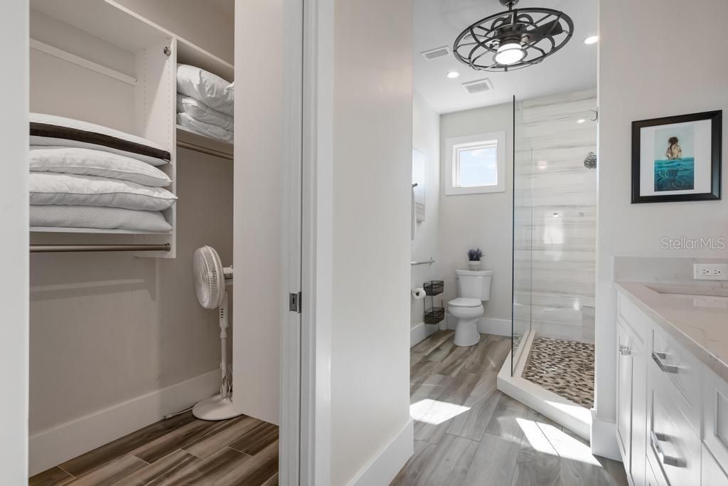 Bathroom, Glass Shower, Interior, Pendant Lights, Recessed Lighting, Wood Texture Flooring