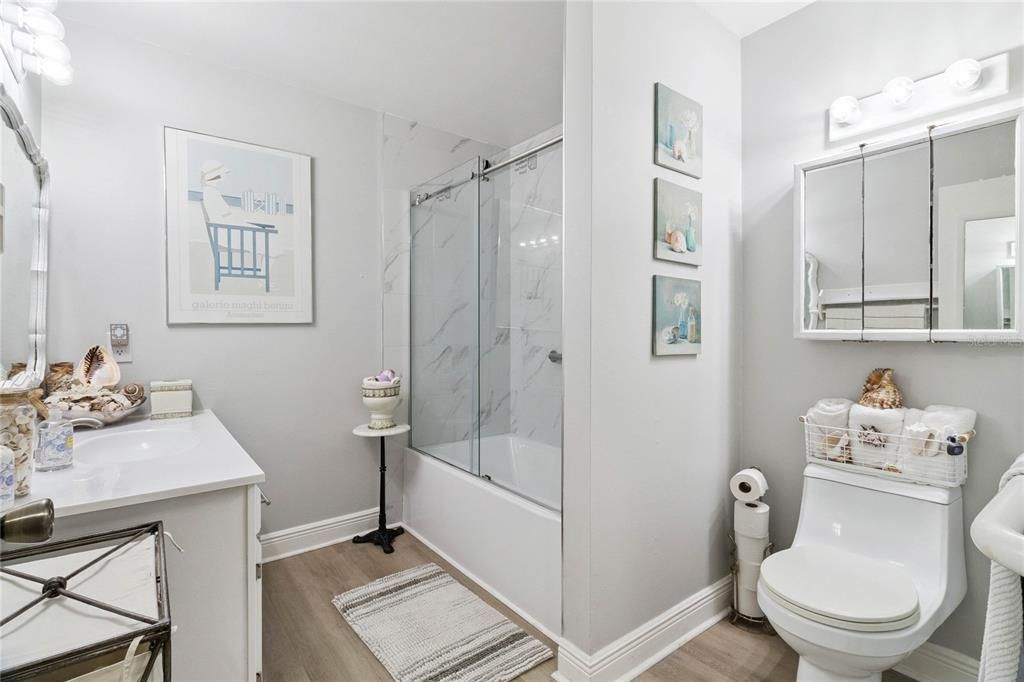 Bathroom, Glass Shower, Interior, Marble Walls, Wood Texture Flooring