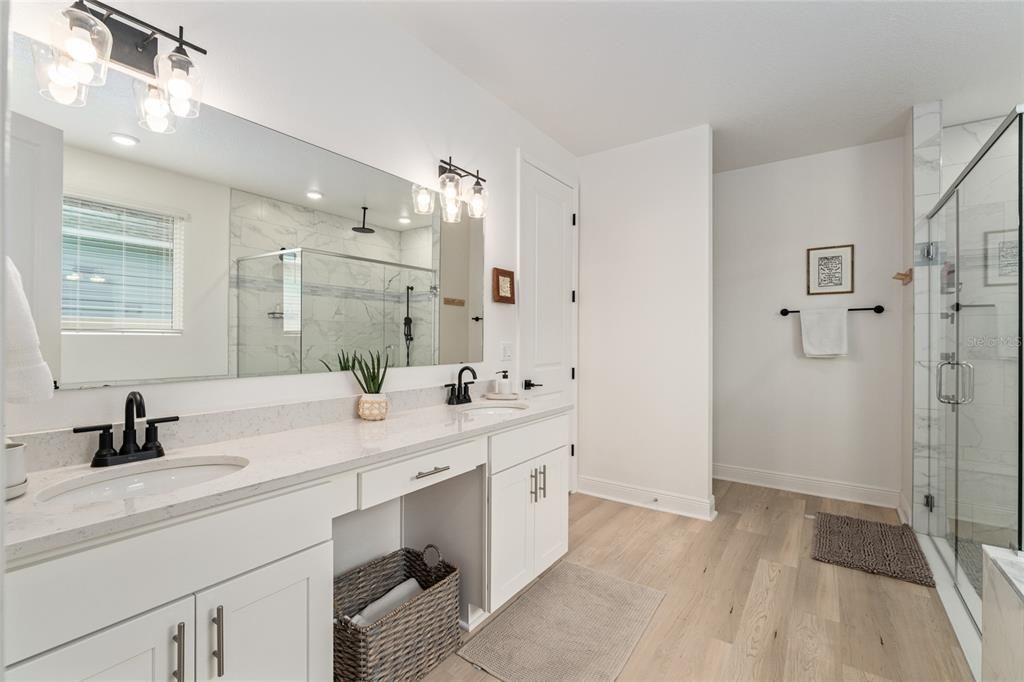 Bathroom, Dual Sink Vanities, Glass Shower, Interior, Marble Walls, Wood Texture Flooring