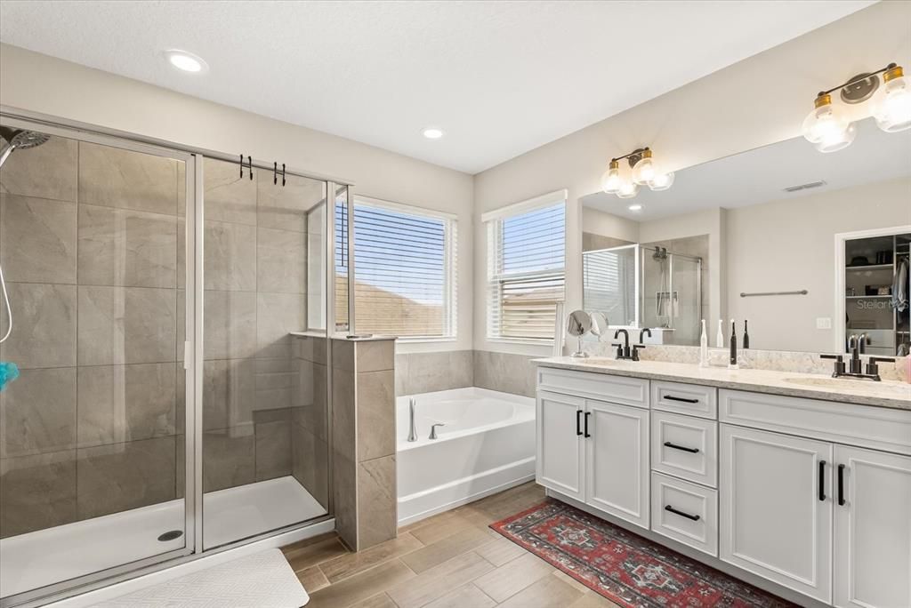 Bathroom, Dual Sink Vanities, Glass Shower, Interior, Recessed Lighting, Wood Texture Flooring
