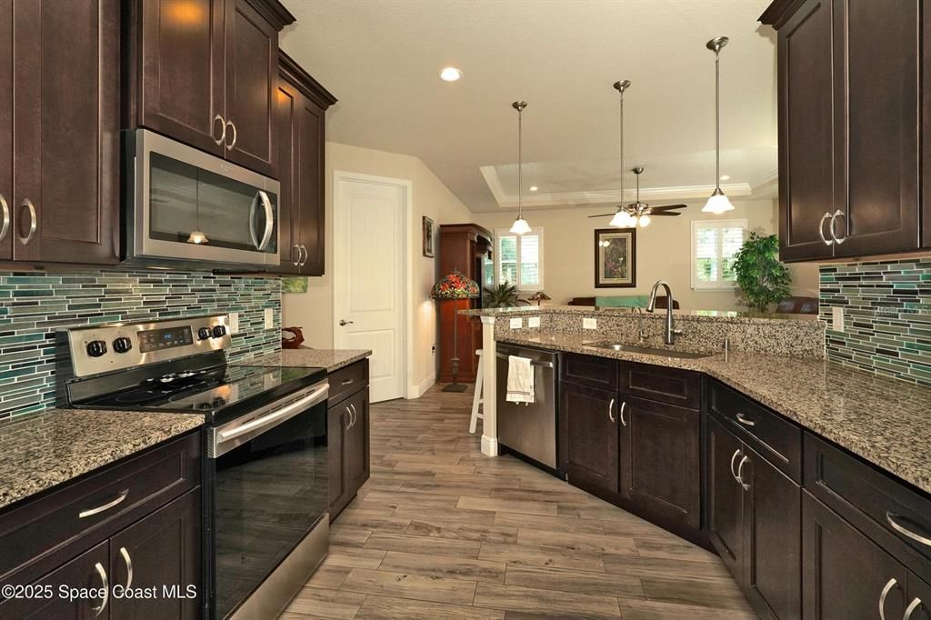 Interior, Kitchen, Pendant Lights, Recessed Lighting, Stainless Steel Appliances, Wood Texture Flooring