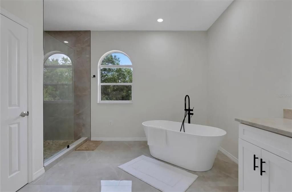 Bathroom, Free Standing Baths, Glass Shower, Interior, Marble Walls, Recessed Lighting
