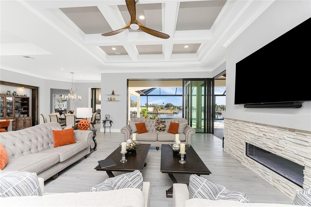 Chandelier, Dining room, Fireplace, Interior, Living room, Pendant Lights, Recessed Lighting, Water, Wood Texture Flooring