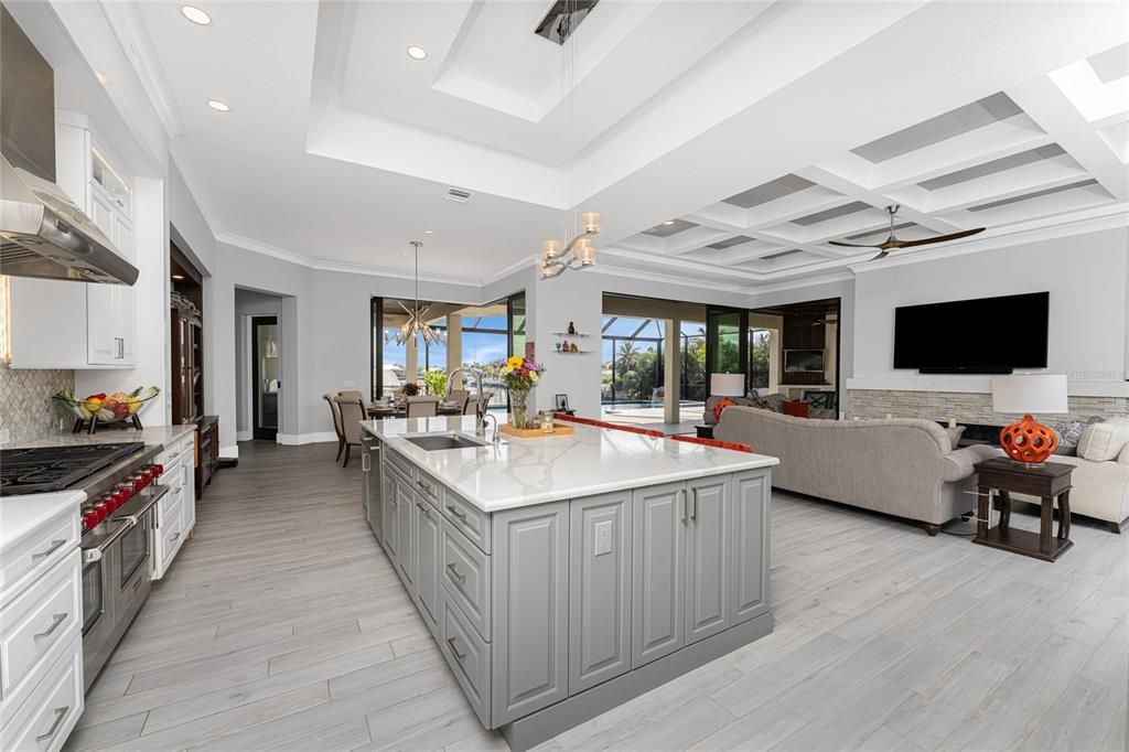 Chandelier, Dining room, Interior, Kitchen, Living room, Pendant Lights, Recessed Lighting, Stainless Steel Appliances, Wood Texture Flooring