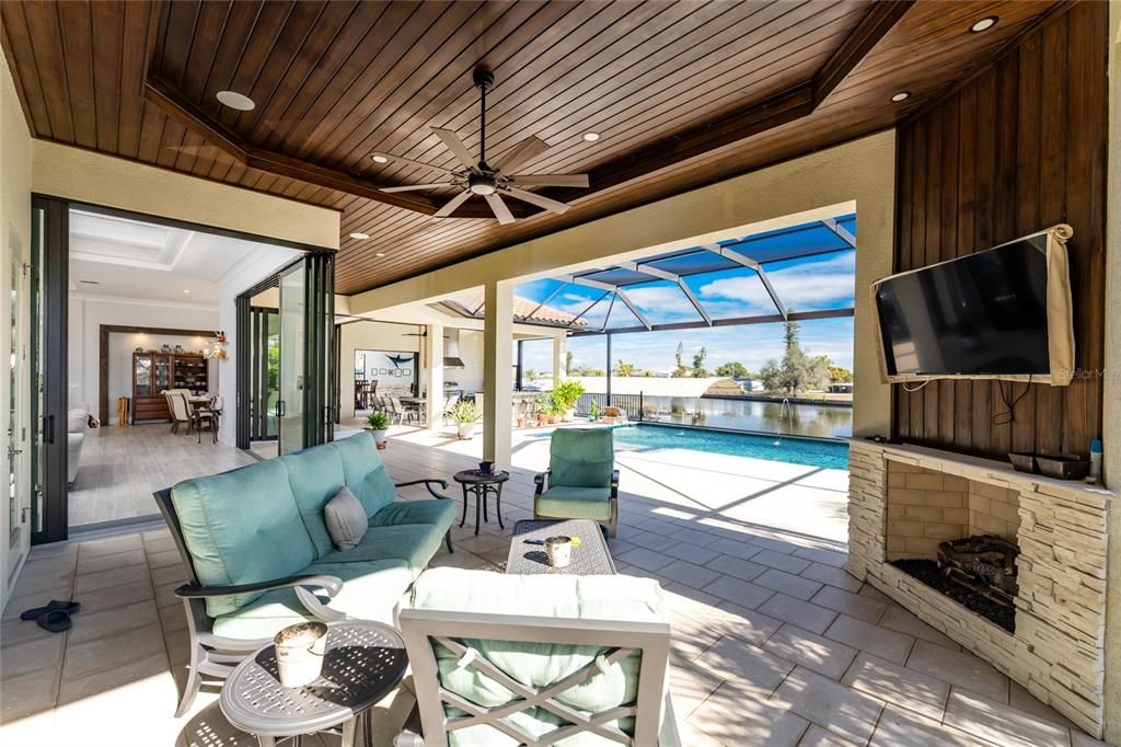 Fireplace, Glass Ceilings, Interior, Living room, Pool, Recessed Lighting, Sun Room, Water, Wooden Ceilings