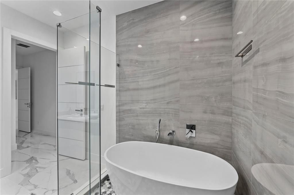 Bathroom, Free Standing Baths, Glass Shower, Interior, Marble, Marble Walls, Recessed Lighting