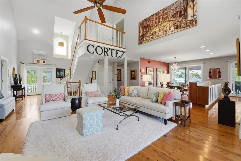 Chandelier, Dining room, Interior, Living room, Piano, Recessed Lighting, Wood Texture Flooring