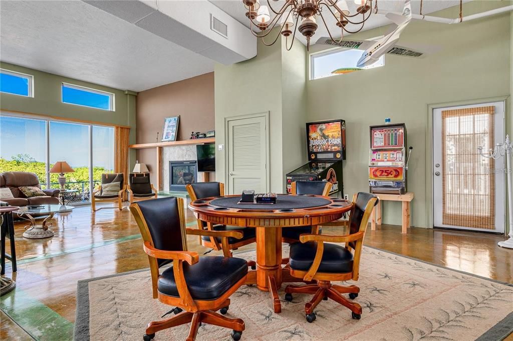 Chandelier, Dining room, Fireplace, Game Room, Interior, Living room, Wood Texture Flooring