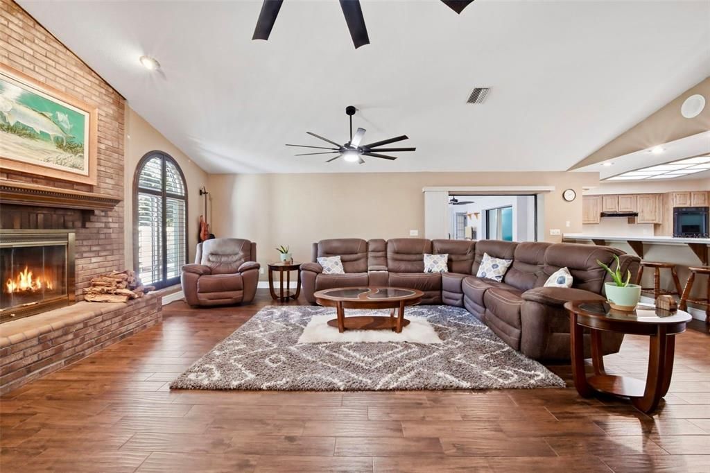 Fireplace, Interior, Kitchen, Living room, Recessed Lighting, Stone Walls, Wood Texture Flooring