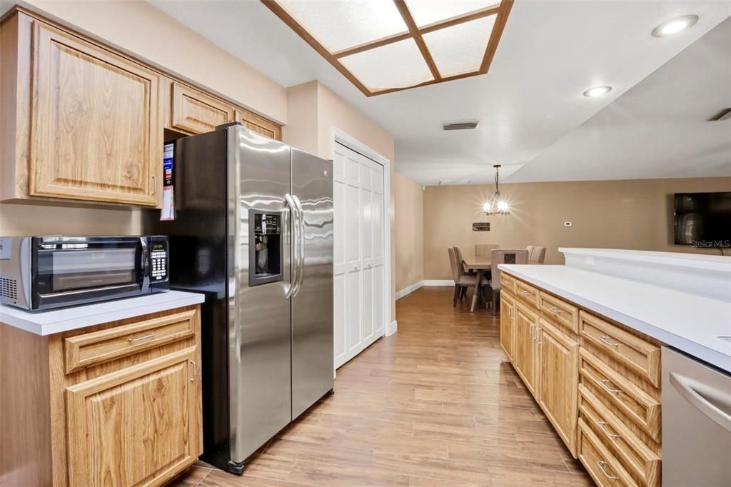 Dining room, Interior, Kitchen, Pendant Lights, Recessed Lighting, Stainless Steel Appliances, Wood Texture Flooring
