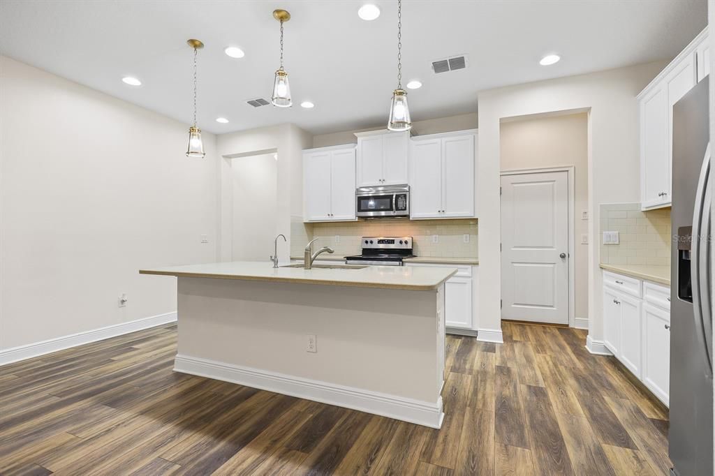 Interior, Kitchen, Pendant Lights, Recessed Lighting, Stainless Steel Appliances, Wood Texture Flooring