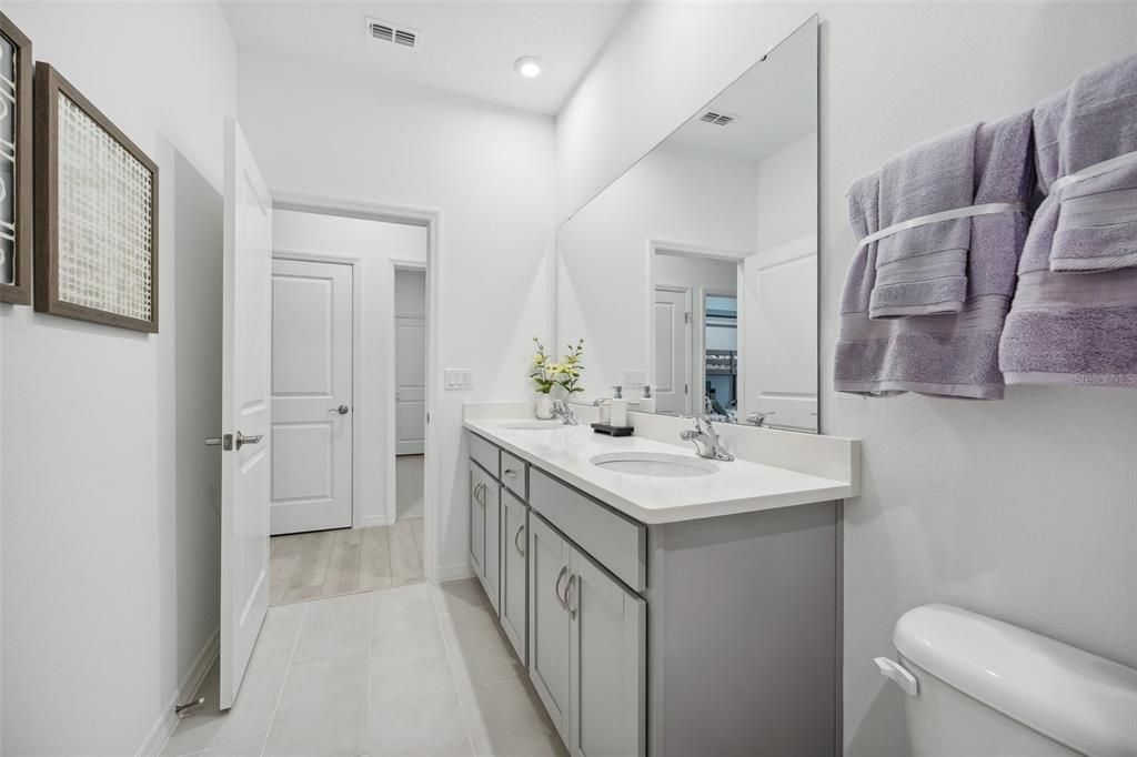 Bathroom, Dual Sink Vanities, Interior, Recessed Lighting, Wood Texture Flooring
