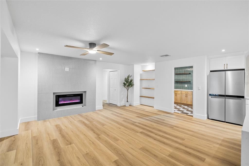 Empty room, Fireplace, Interior, Kitchen, Recessed Lighting, Wood Texture Flooring