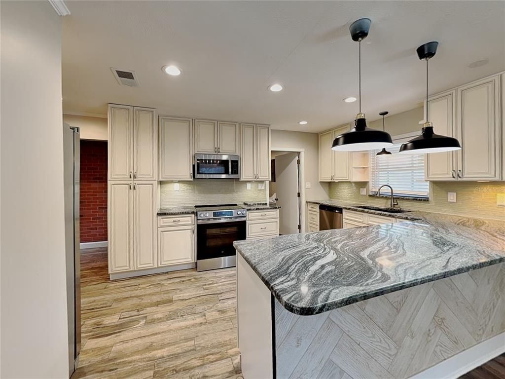 Interior, Kitchen, Pendant Lights, Recessed Lighting, Stainless Steel Appliances, Wood Texture Flooring