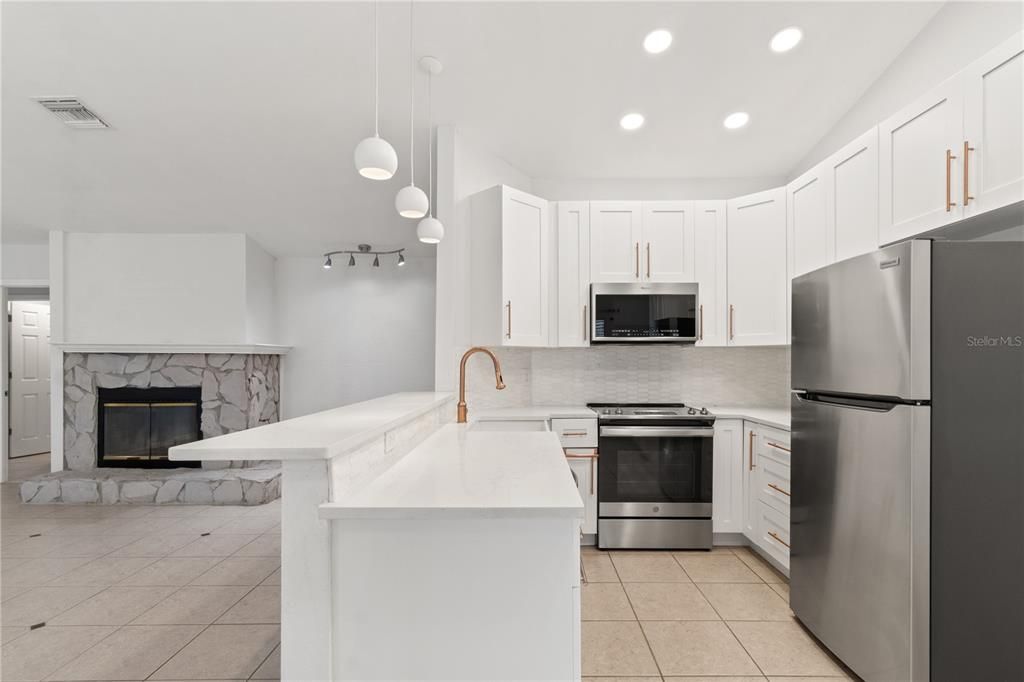 Fireplace, Interior, Kitchen, Pendant Lights, Recessed Lighting, Stainless Steel Appliances