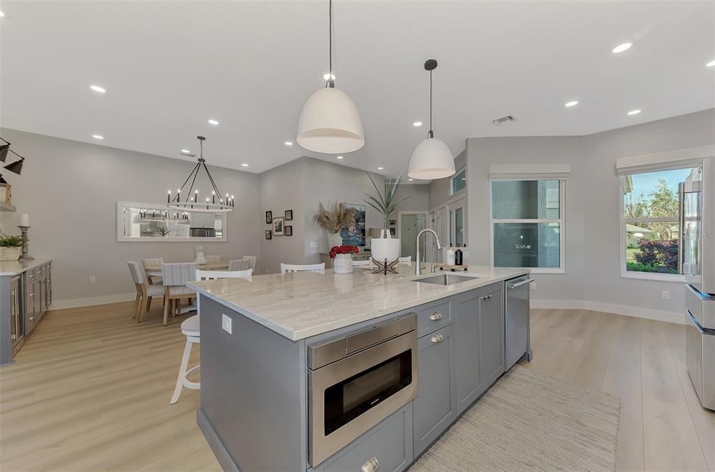 Dining room, Interior, Kitchen, Pendant Lights, Recessed Lighting, Stainless Steel Appliances, Wood Texture Flooring