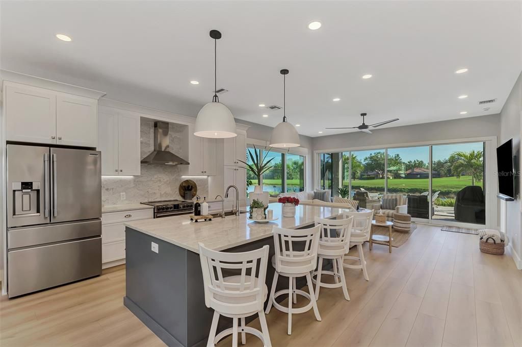 Dining room, Interior, Kitchen, Pendant Lights, Recessed Lighting, Stainless Steel Appliances, Wood Texture Flooring