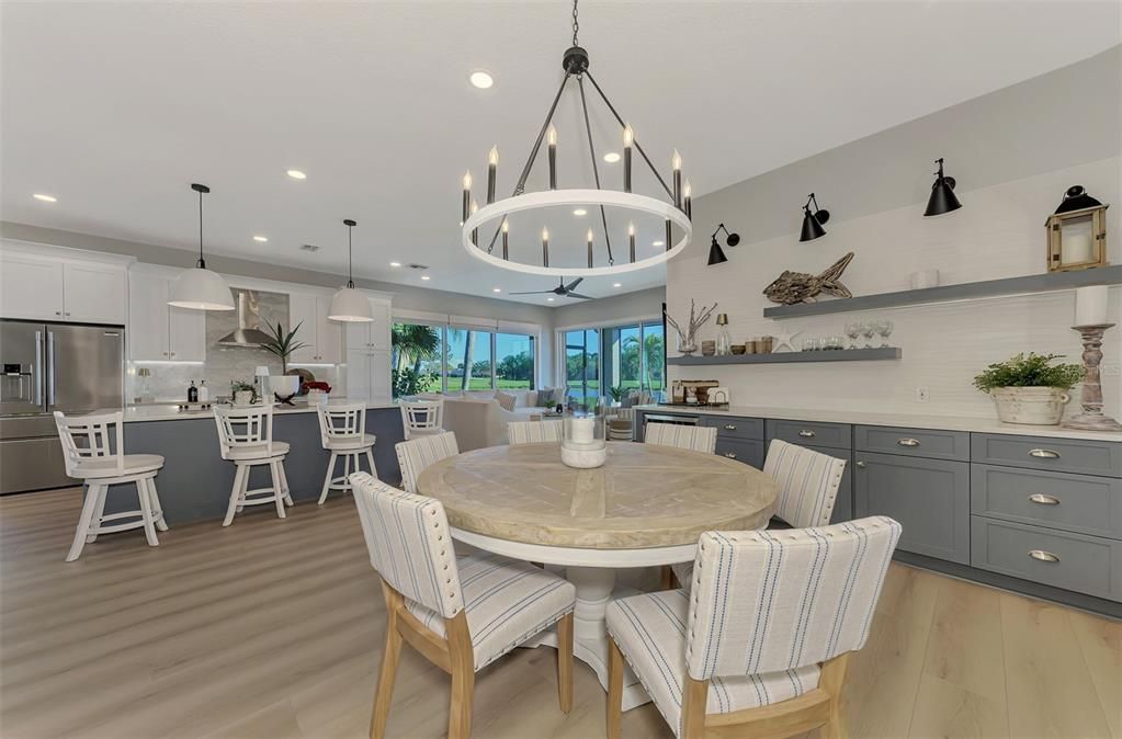 Chandelier, Dining room, Interior, Kitchen, Pendant Lights, Recessed Lighting, Stainless Steel Appliances, Wood Texture Flooring