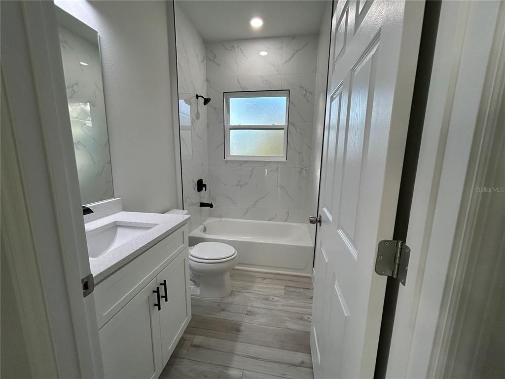 Bathroom, Interior, Marble Walls, Recessed Lighting, Wood Texture Flooring