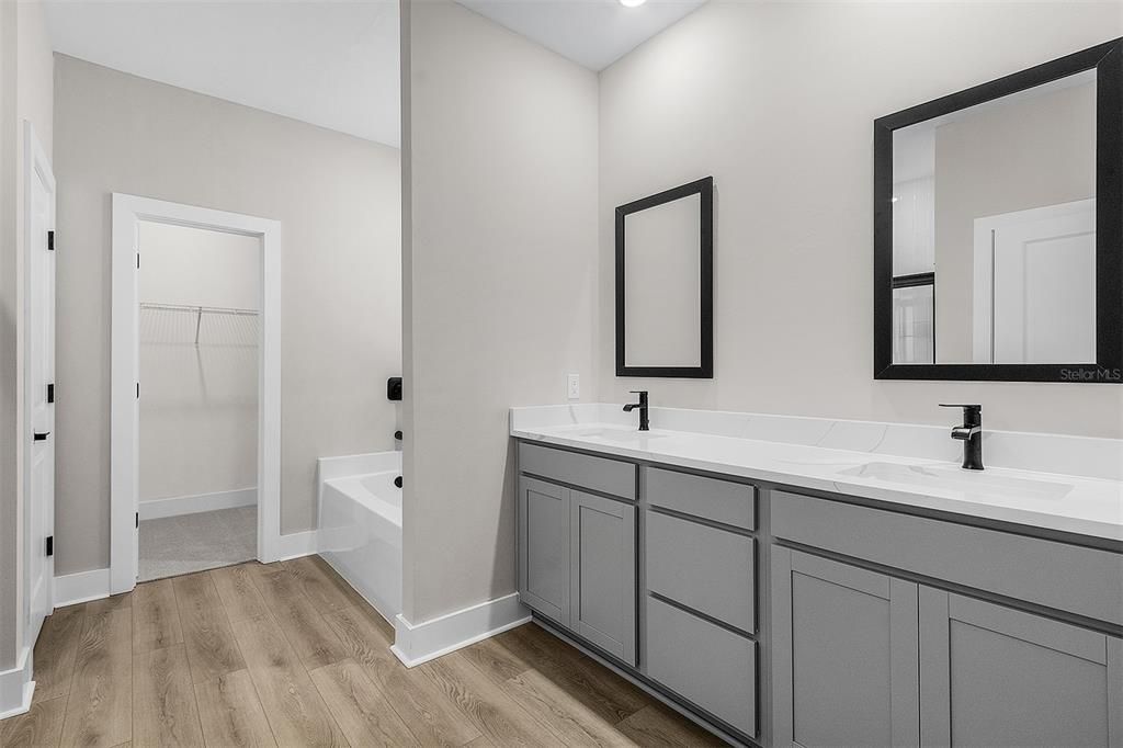 Bathroom, Dual Sink Vanities, Interior, Recessed Lighting, Wood Texture Flooring