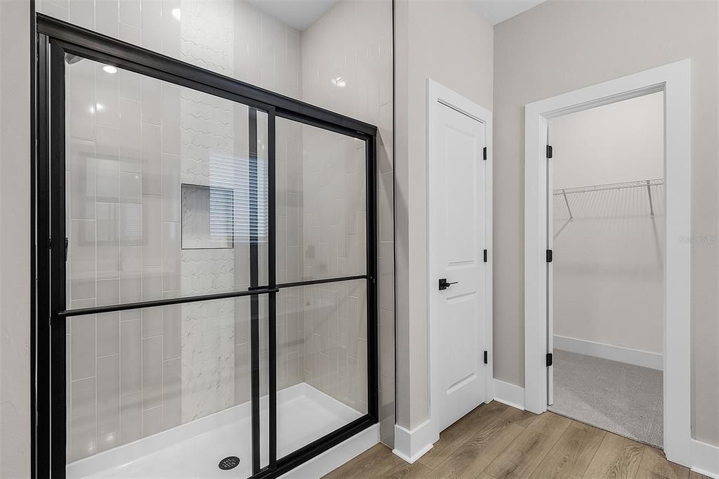 Bathroom, Glass Shower, Interior, Recessed Lighting, Walk-in Closets, Wood Texture Flooring