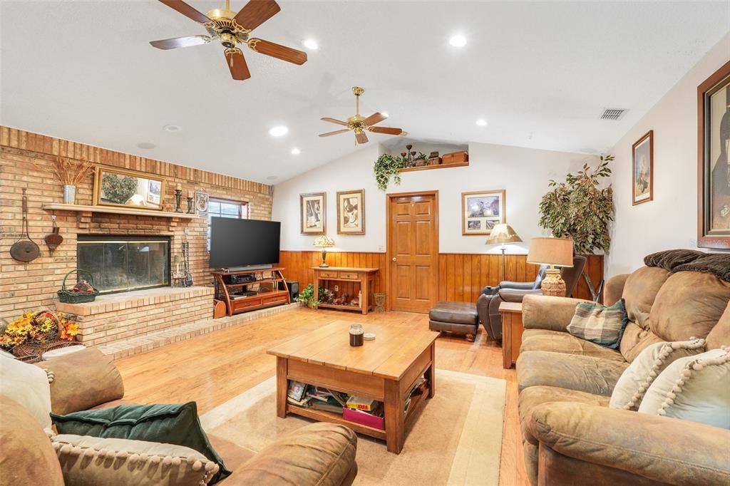 Fireplace, Interior, Living room, Recessed Lighting, Stone Walls, Wood Texture Flooring