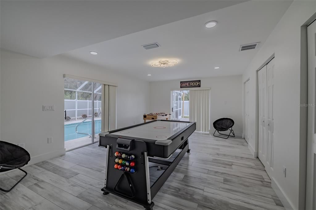 Fitness Equipment, Game Room, Interior, Recessed Lighting, Wood Texture Flooring
