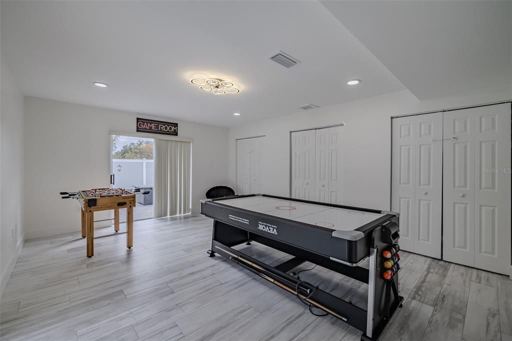Fitness Equipment, Game Room, Interior, Recessed Lighting, Wood Texture Flooring