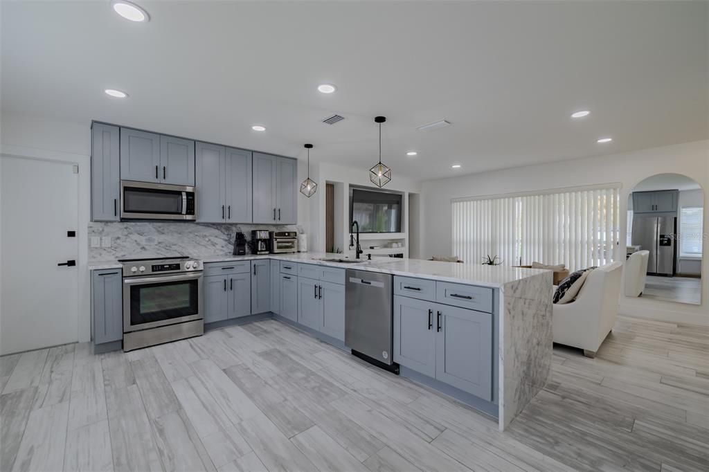 Interior, Kitchen, Pendant Lights, Recessed Lighting, Stainless Steel Appliances, Wood Texture Flooring