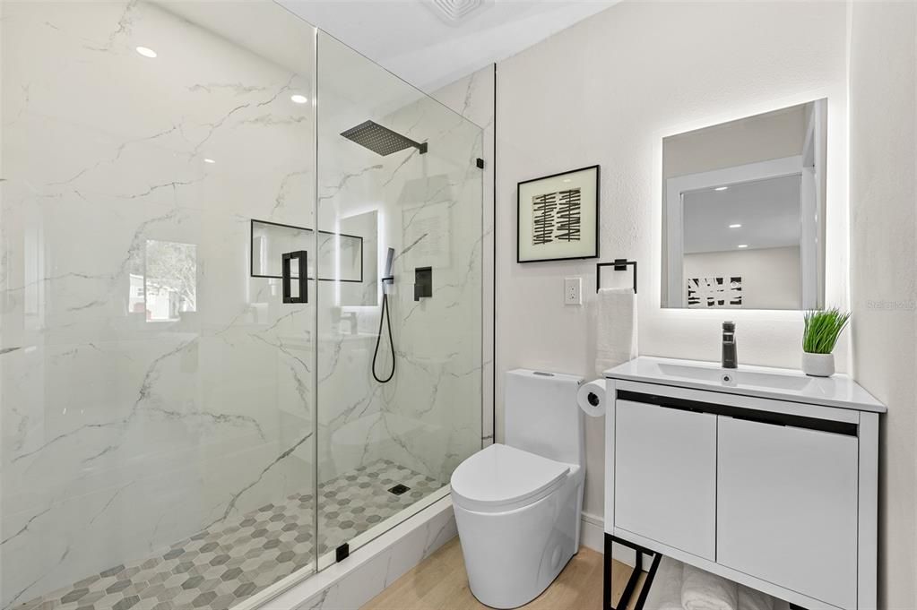 Bathroom, Glass Shower, Interior, Marble Walls, Recessed Lighting, Wood Texture Flooring