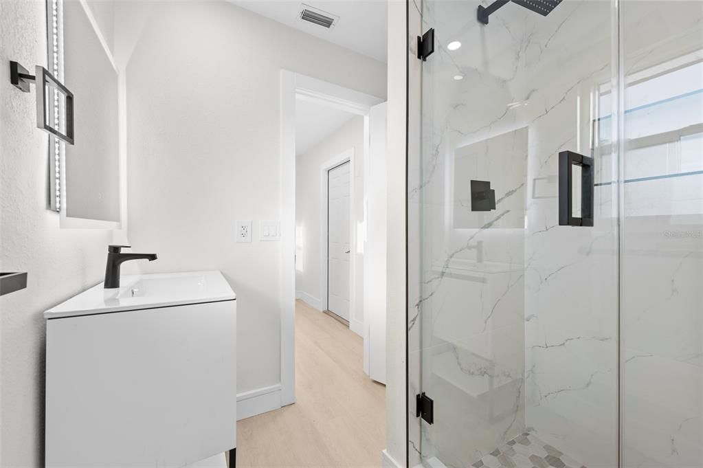 Bathroom, Glass Shower, Interior, Marble Walls, Wood Texture Flooring