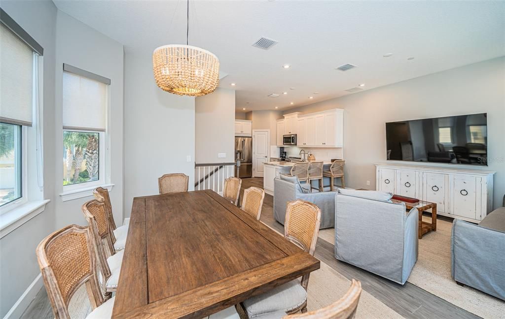 Chandelier, Dining room, Interior, Kitchen, Living room, Pendant Lights, Recessed Lighting, Stainless Steel Appliances, Wood Texture Flooring