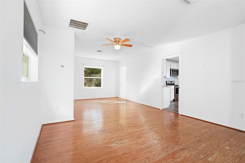 Empty room, Interior, Kitchen, Stainless Steel Appliances, Wood Texture Flooring