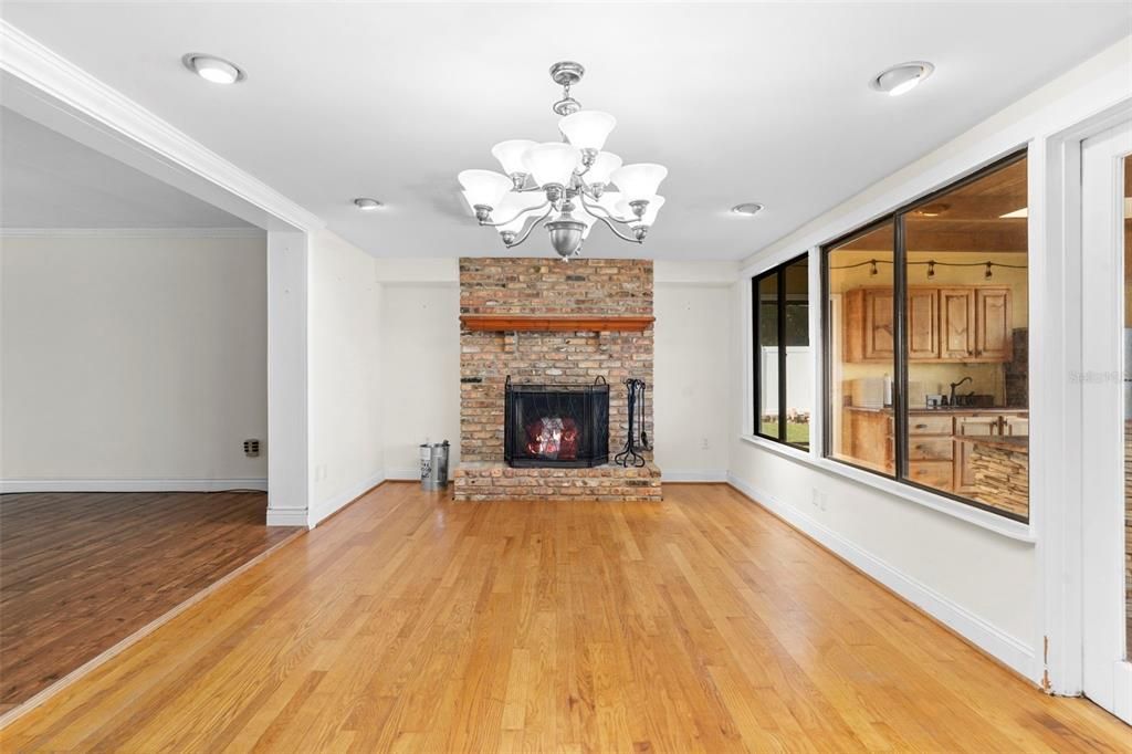 Chandelier, Empty room, Fireplace, Interior, Recessed Lighting, Wood Texture Flooring