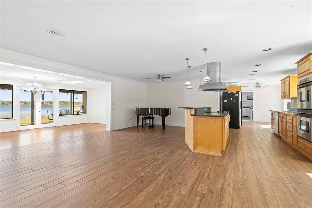 Chandelier, Interior, Kitchen, Pendant Lights, Piano, Recessed Lighting, Stainless Steel Appliances, Water, Wood Texture Flooring