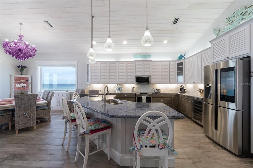 Chandelier, Dining room, Interior, Kitchen, Pendant Lights, Recessed Lighting, Stainless Steel Appliances, Water, Wood Texture Flooring