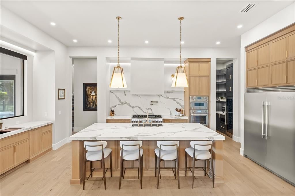 Interior, Kitchen, Marble Walls, Pendant Lights, Recessed Lighting, Stainless Steel Appliances, Wood Texture Flooring