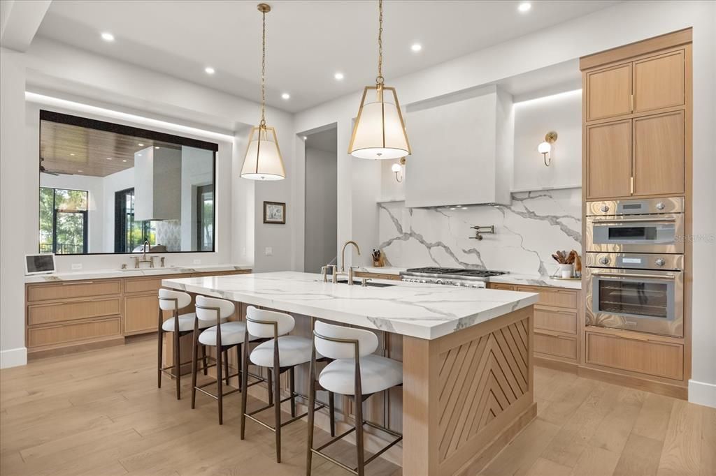 Interior, Kitchen, Marble Walls, Pendant Lights, Recessed Lighting, Stainless Steel Appliances, Wood Texture Flooring