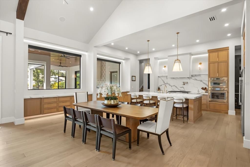 Dining room, Interior, Kitchen, Marble Walls, Pendant Lights, Recessed Lighting, Stainless Steel Appliances, Wood Texture Flooring