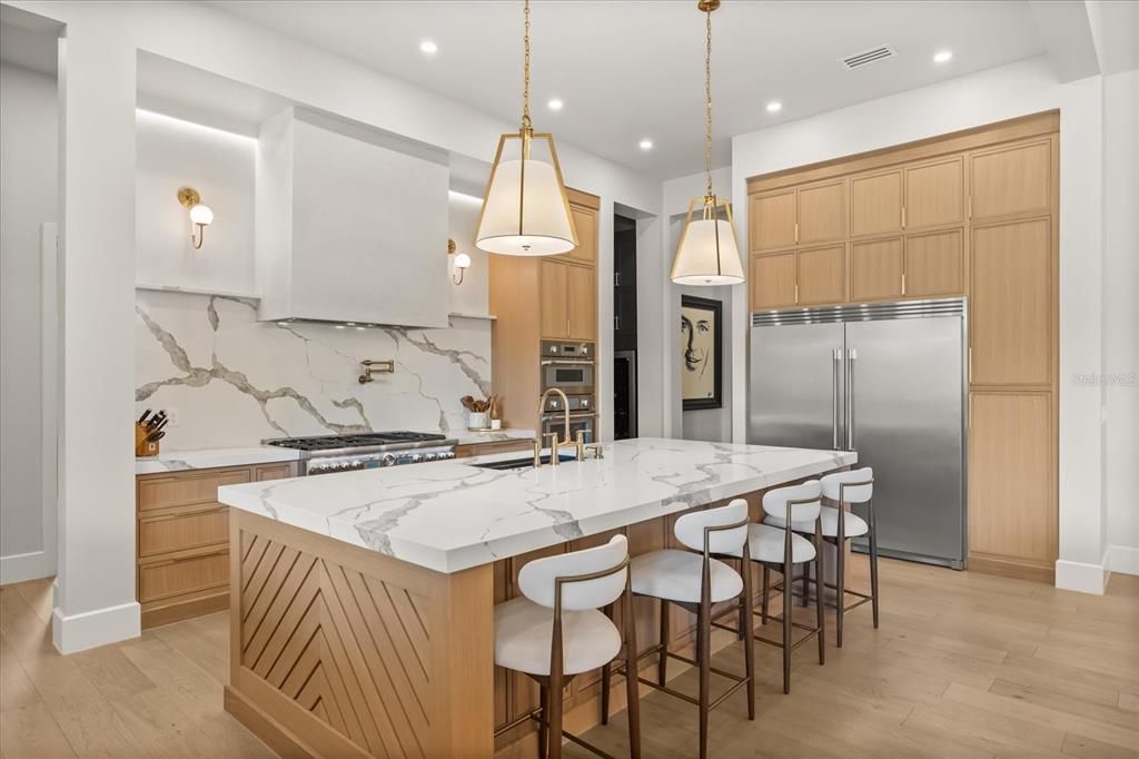 Interior, Kitchen, Marble Walls, Pendant Lights, Recessed Lighting, Stainless Steel Appliances, Wood Texture Flooring