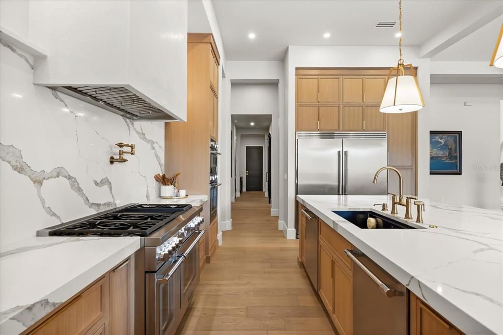 Interior, Kitchen, Marble Walls, Pendant Lights, Recessed Lighting, Stainless Steel Appliances, Wood Texture Flooring