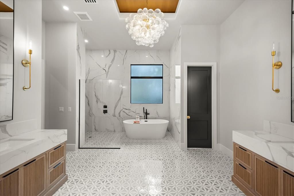 Bathroom, Chandelier, Dual Sink Vanities, Free Standing Baths, Glass Shower, Interior, Marble, Marble Walls, Recessed Lighting