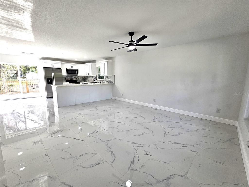 Empty room, Interior, Kitchen, Marble, Recessed Lighting, Stainless Steel Appliances