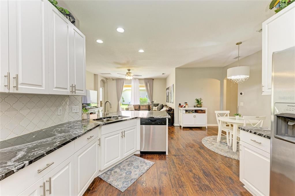Chandelier, Dining room, Interior, Kitchen, Living room, Recessed Lighting, Wood Texture Flooring