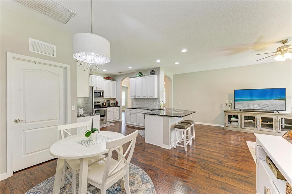 Chandelier, Dining room, Interior, Kitchen, Recessed Lighting, Stainless Steel Appliances, Wood Texture Flooring