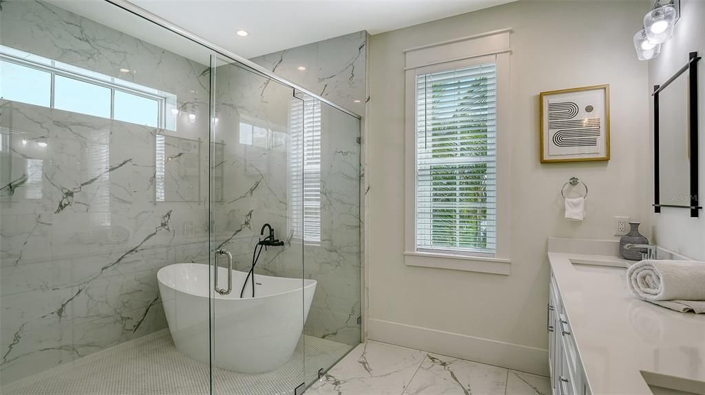 Bathroom, Free Standing Baths, Glass Shower, Interior, Marble, Marble Walls, Recessed Lighting