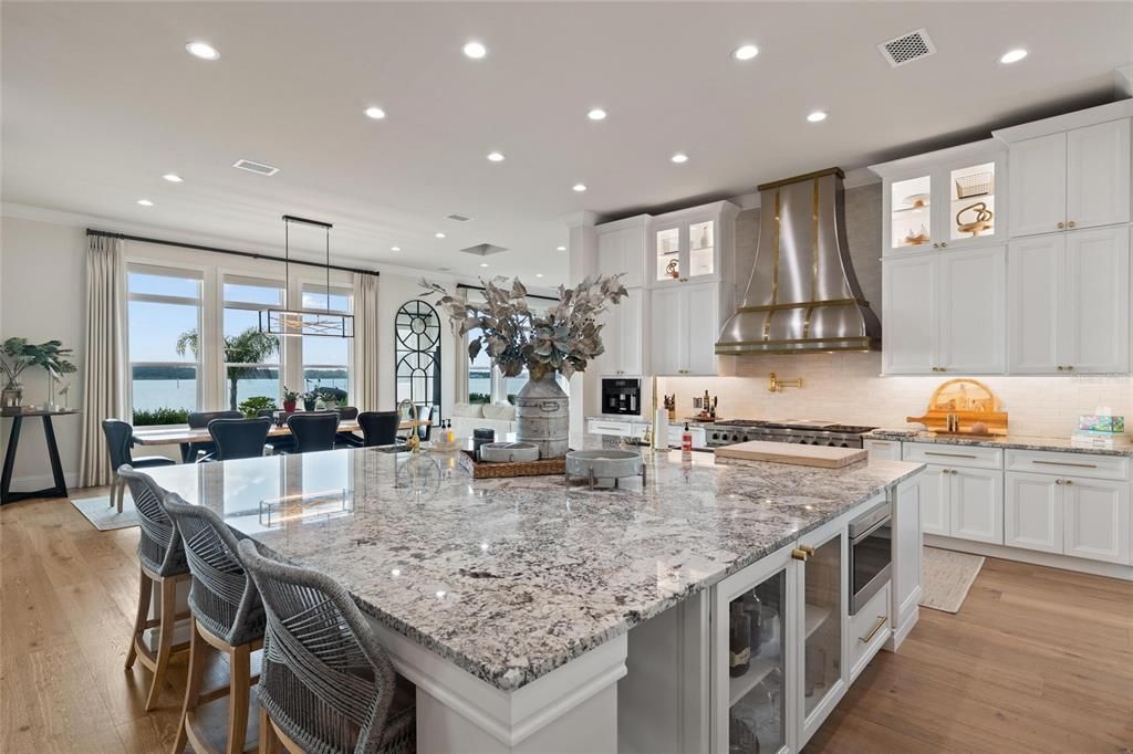 Dining room, Interior, Kitchen, Pendant Lights, Recessed Lighting, Stainless Steel Appliances, Water, Wood Texture Flooring