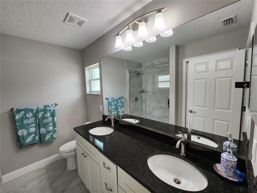 Bathroom, Dual Sink Vanities, Glass Shower, Interior, Marble, Marble Walls