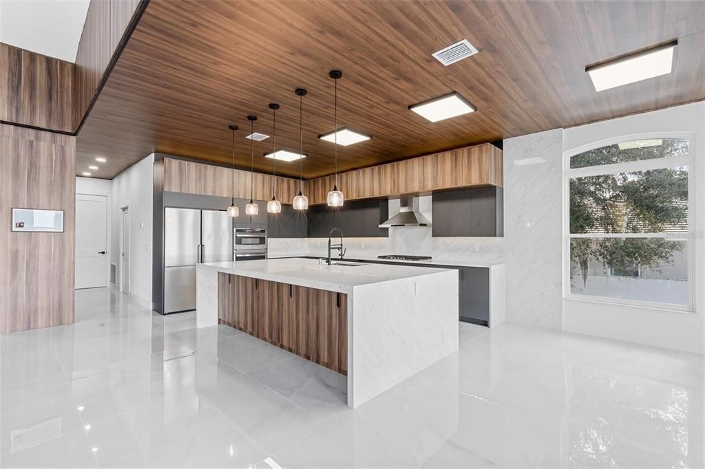 Interior, Kitchen, Marble Walls, Pendant Lights, Recessed Lighting, Stainless Steel Appliances, Wooden Ceilings