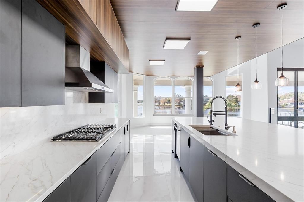 Interior, Kitchen, Marble, Marble Walls, Pendant Lights, Recessed Lighting, Stainless Steel Appliances